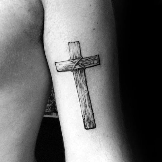 Tattoo of a cross on your arm