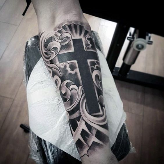 Tattoo of a cross on your arm