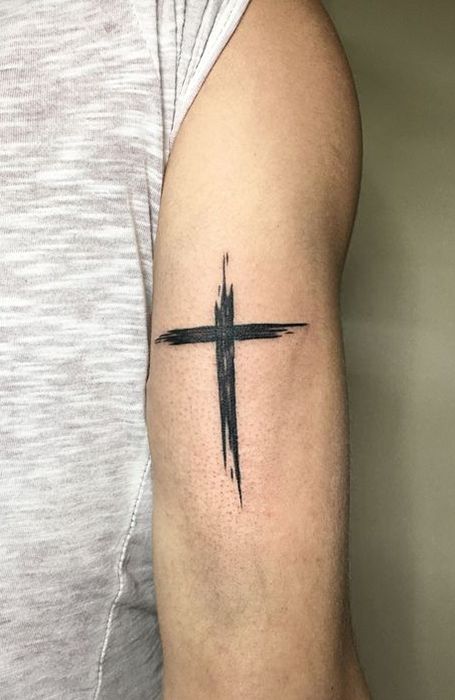 Tattoo of a cross on your arm