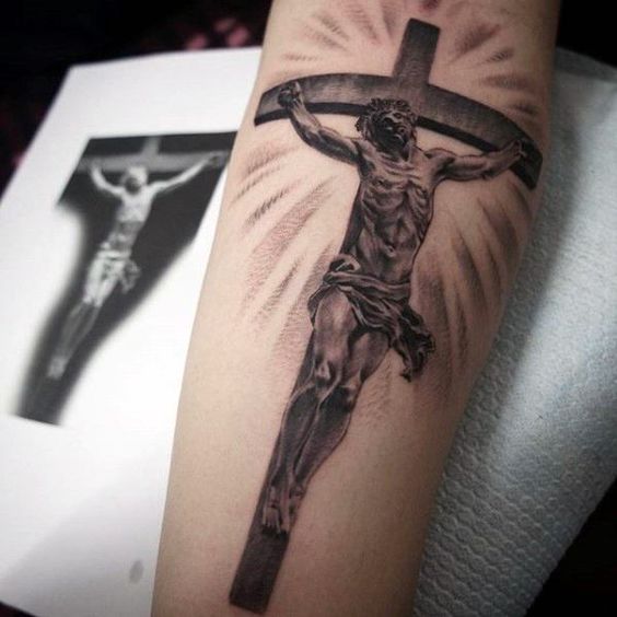 Tattoo of a cross on your arm