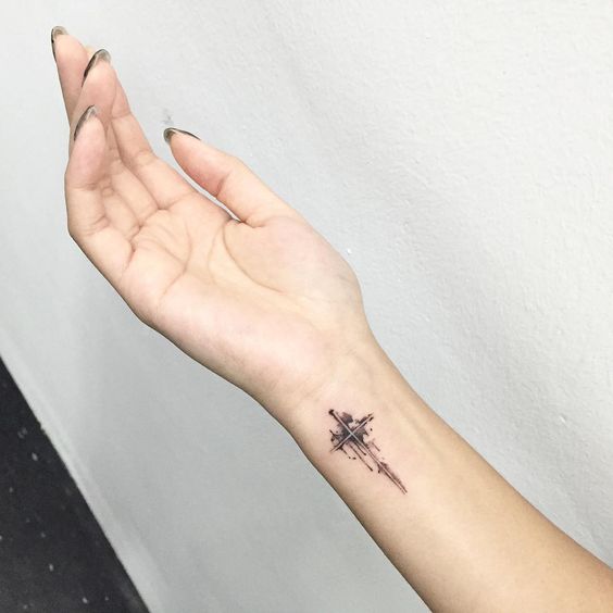 Tattoo of a cross on your arm