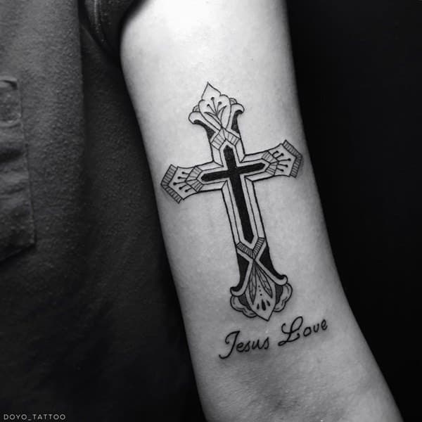 Tattoo of a cross on your arm