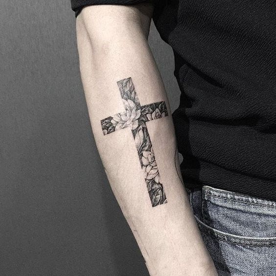 Tattoo of a cross on your arm