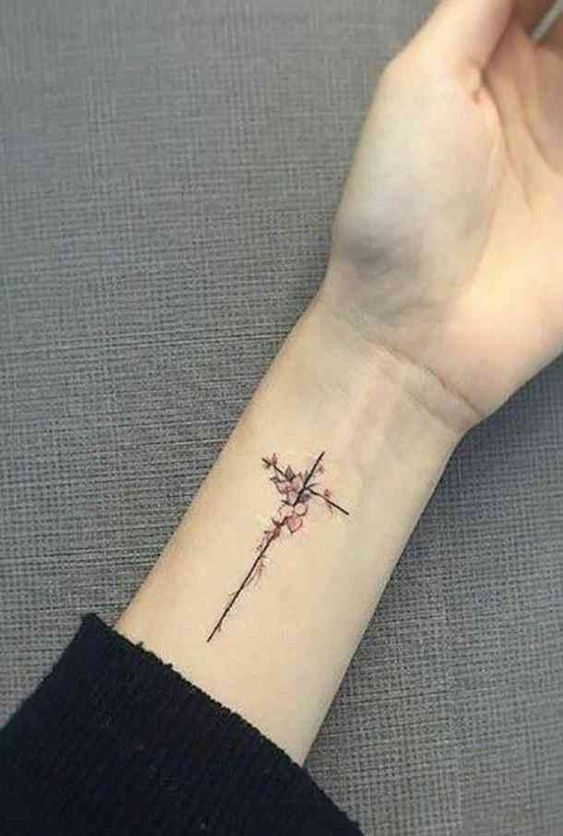 Tattoo of a cross on your arm