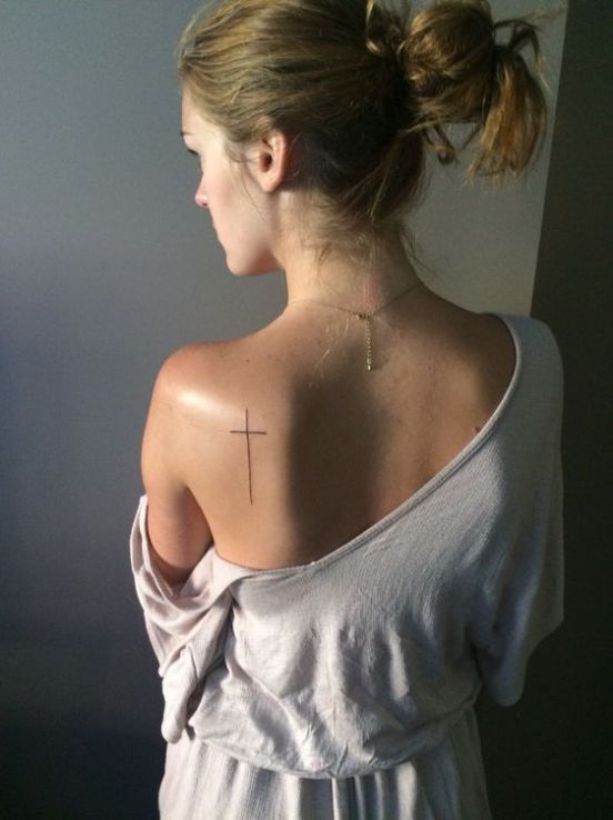 Tattoo of a cross on your back