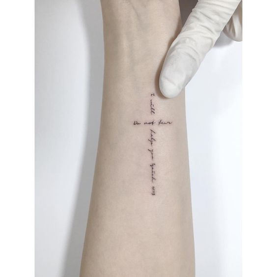 Tattoo of a cross on your arm