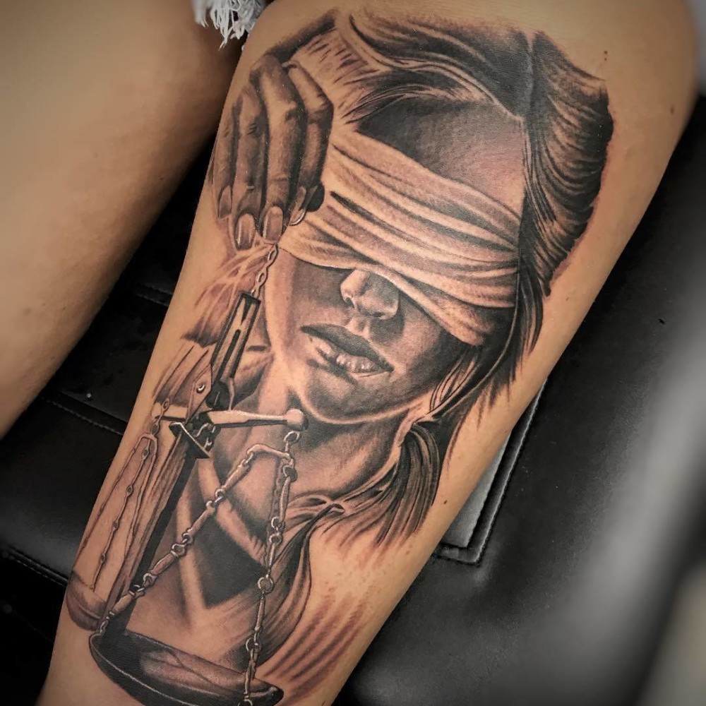 Realism tattoo on the thigh