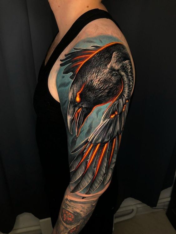 Tattoo of birds on the shoulder in the style of realism