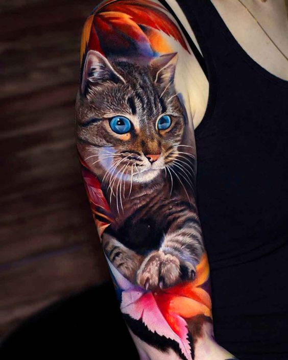 Realistic cat tattoo on the arm