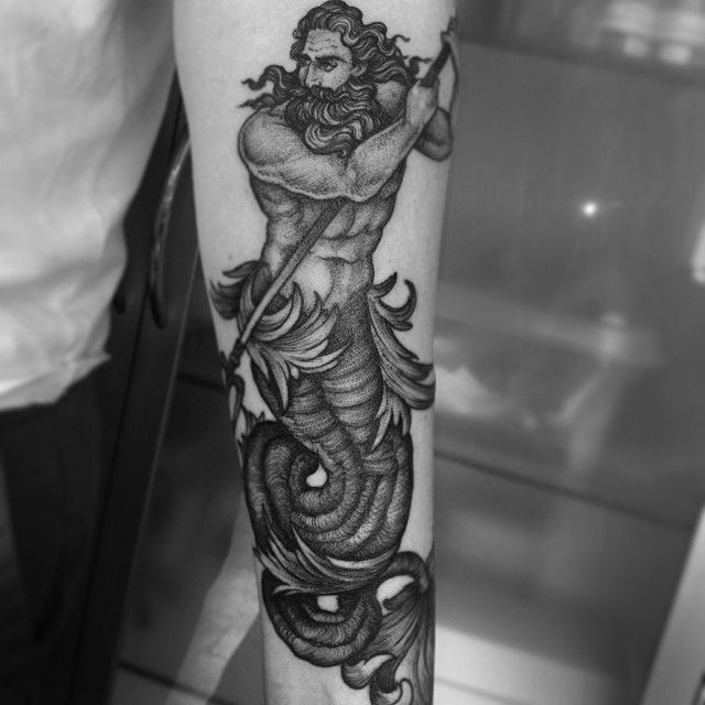 Tattoo of the god Poseidon on the arm