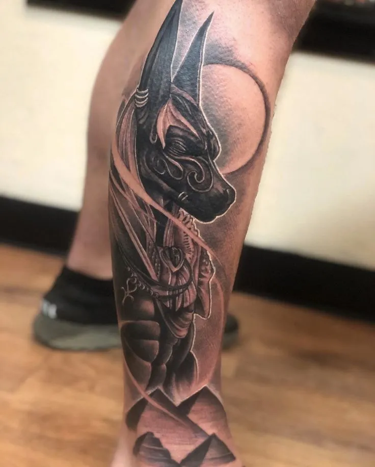 Tattoo of Anubis on the leg