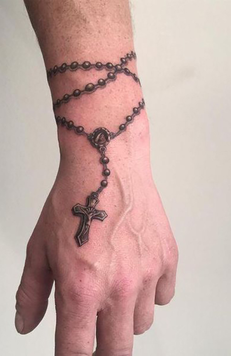 3D cross tattoo on the wrist