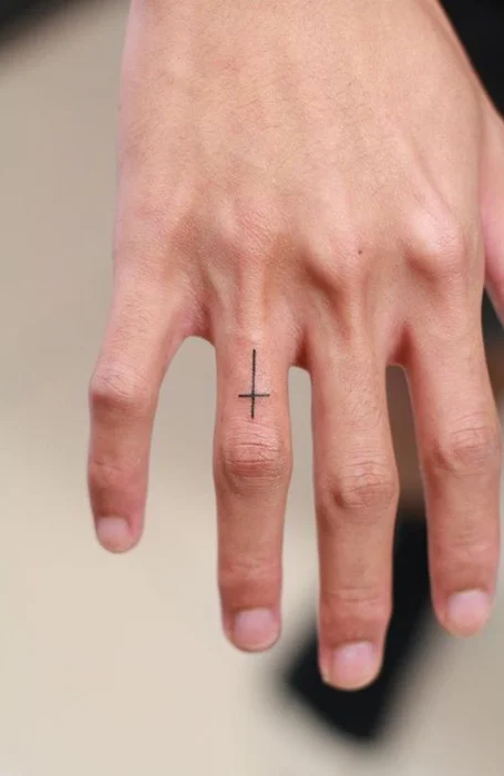 Tattoo a cross on your finger