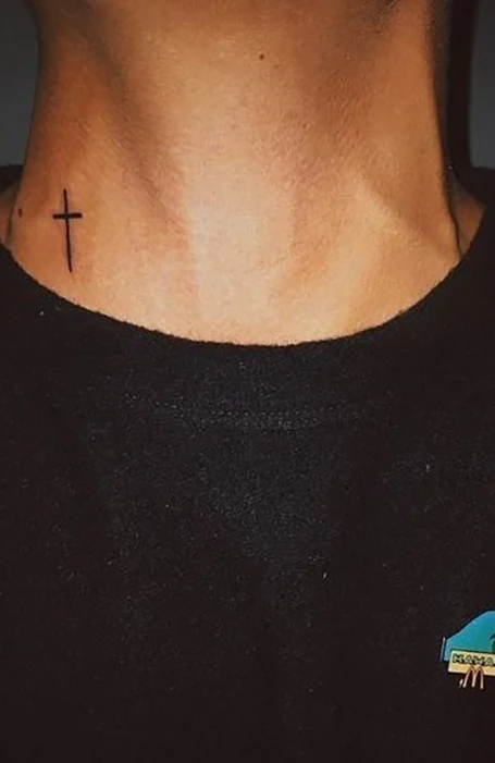 Cross tattoo on the neck