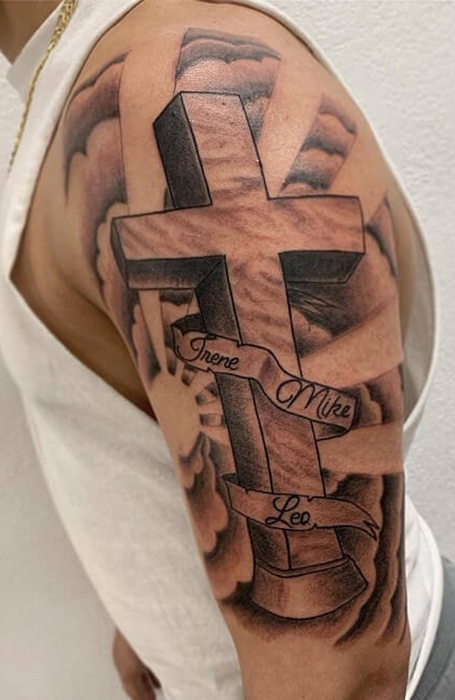 Cross tattoo on the shoulder