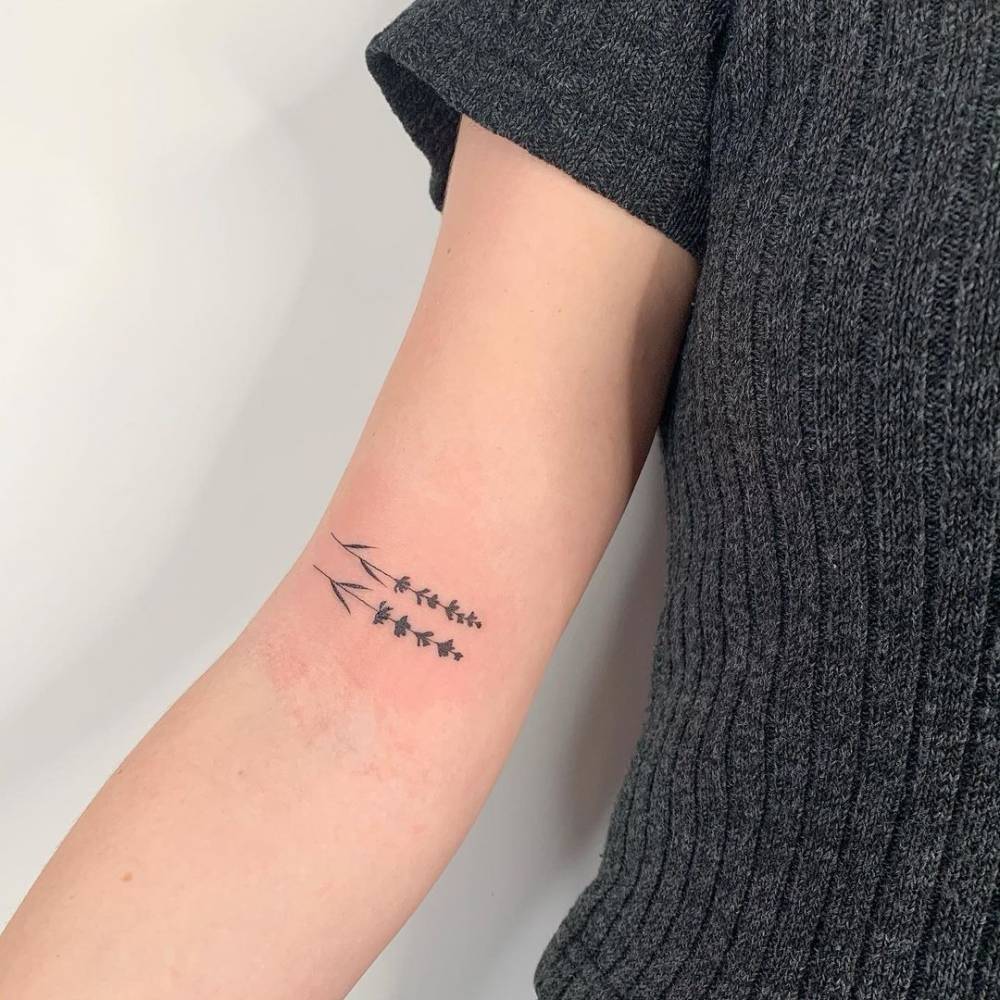 Minimalist tattoo on the biceps