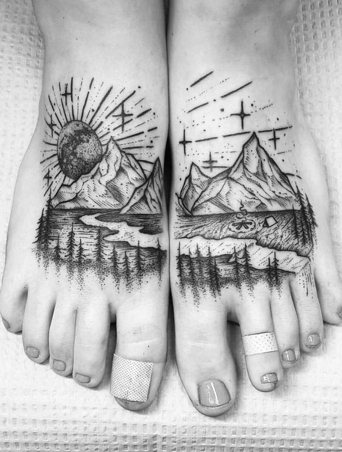 Tattoo of mountains on legs