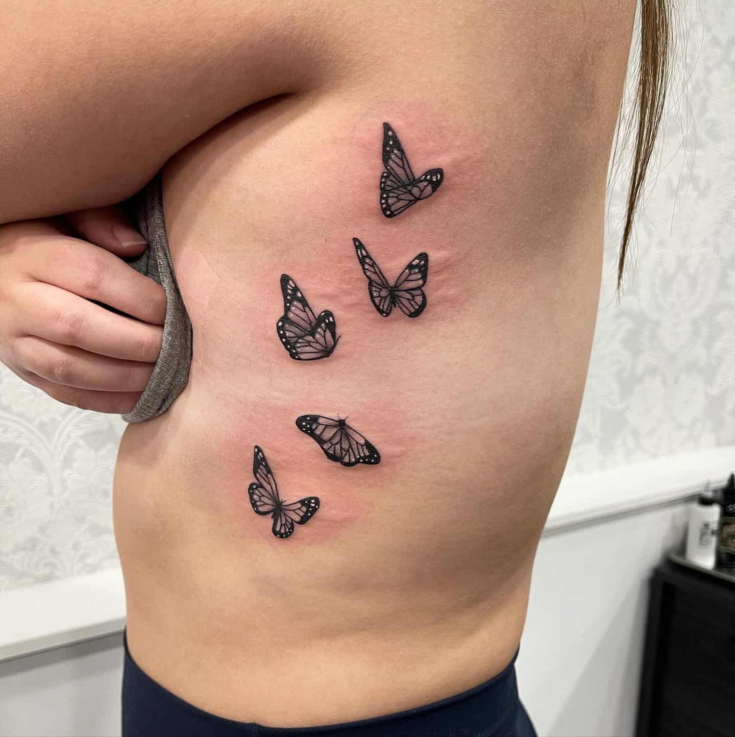 Butterflies tattoo on the side for women