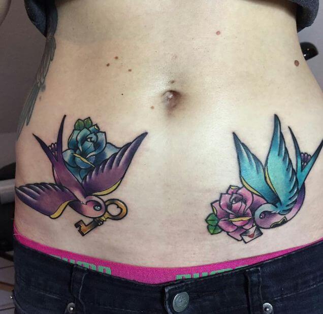 Tattoo of birds on the belly