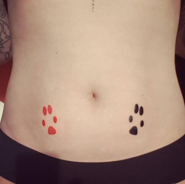 Cute dog paw tattoo design on the stomach