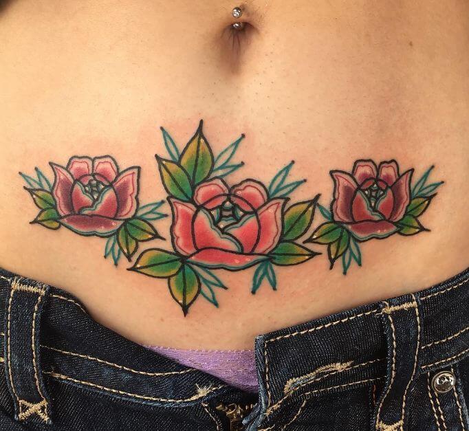 Tattoo of flowers in the lower abdomen