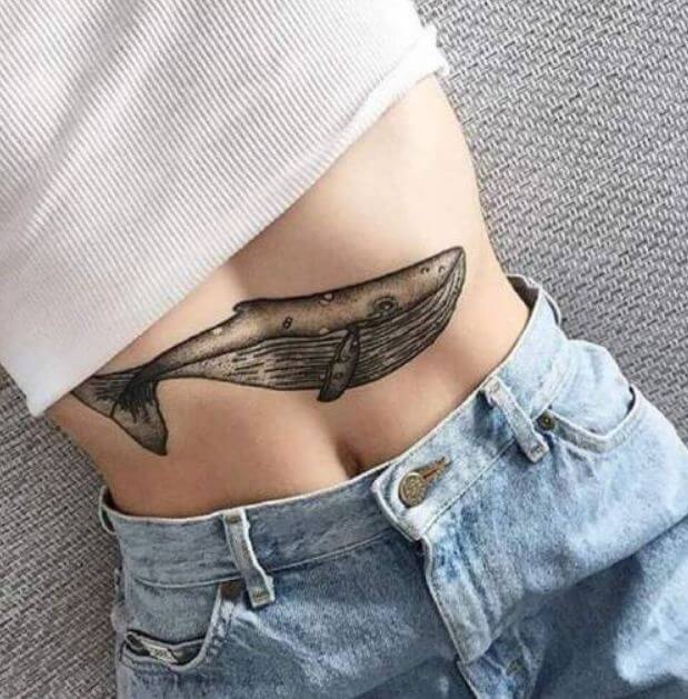 Whale tattoo on stomach