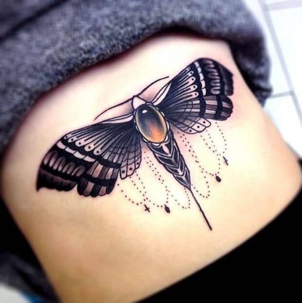 Butterfly and moth tattoos on the abdomen