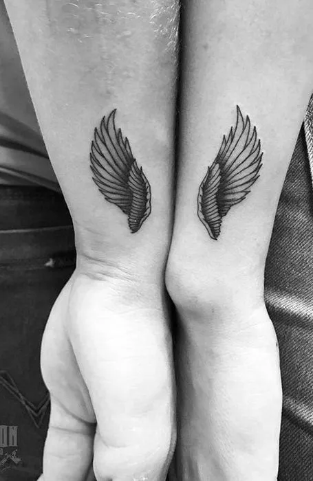 Tattoo of angel wings on the wrist