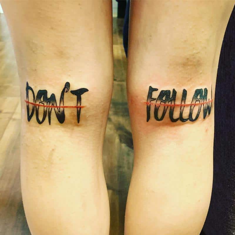 Tattoo inscriptions on the knee