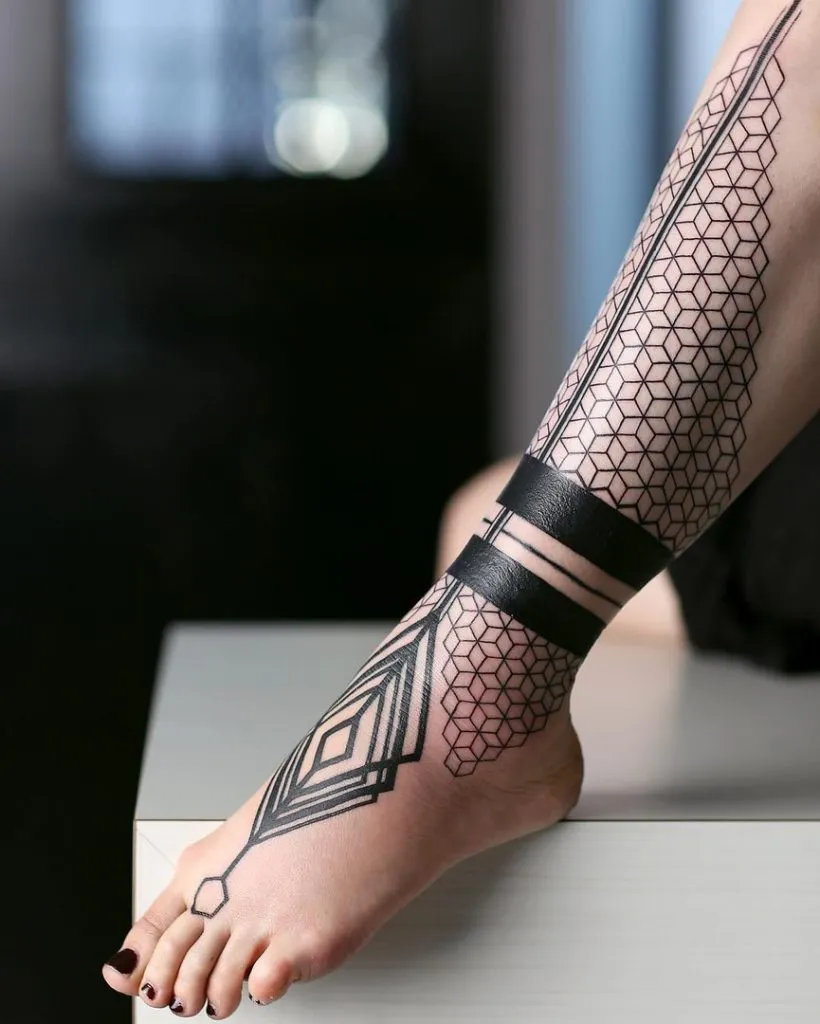 Geometric tattoos on shins