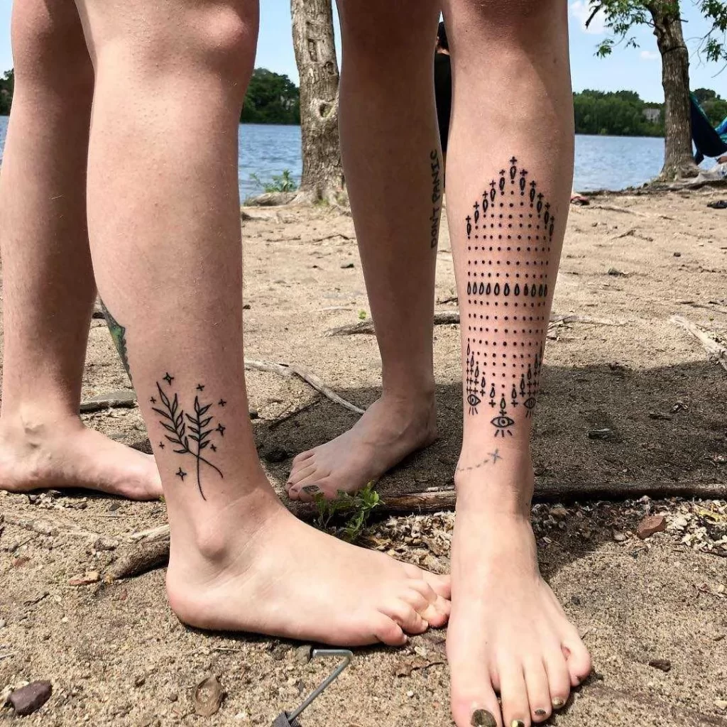 Tattoo on the shin in the style of minimalism