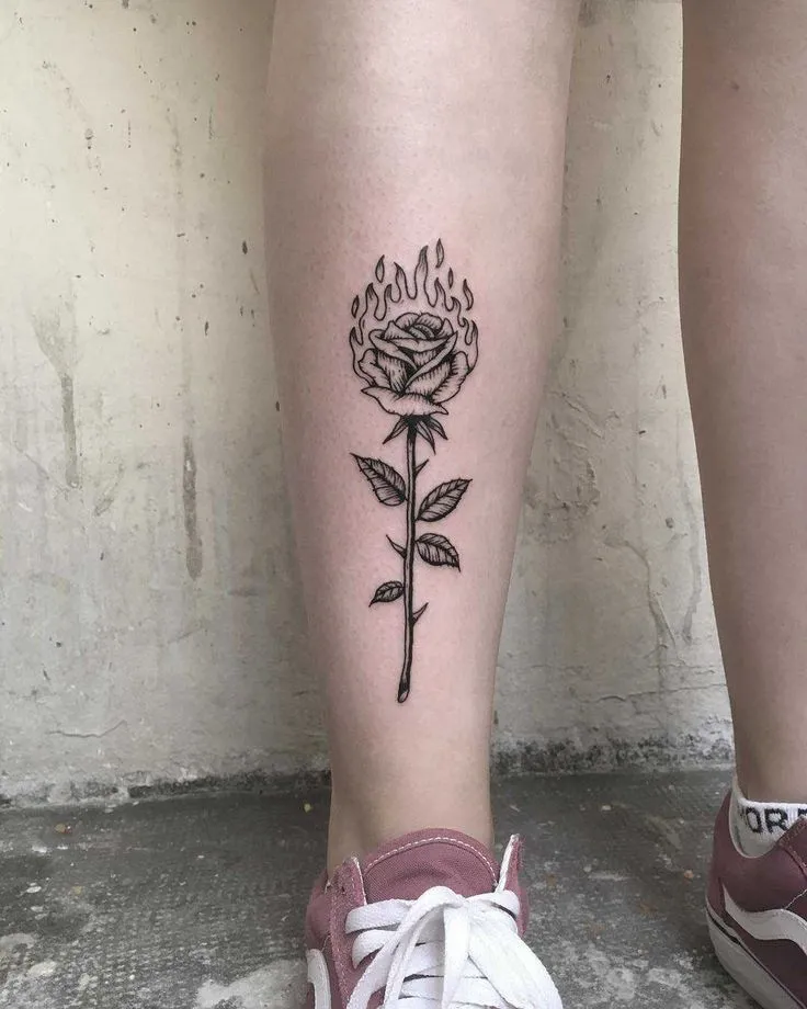 Tattoos of roses on the shin