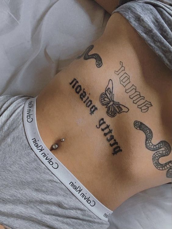 Female butterfly tattoo on belly