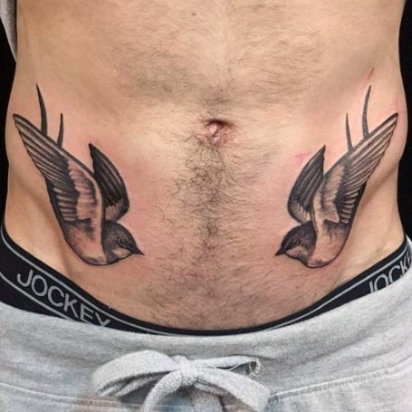 Tattoo of swallows on the stomach