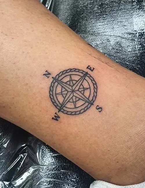 Ankle compass tattoo