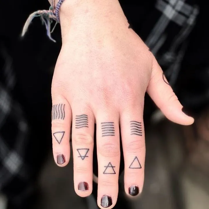 Women's finger tattoos