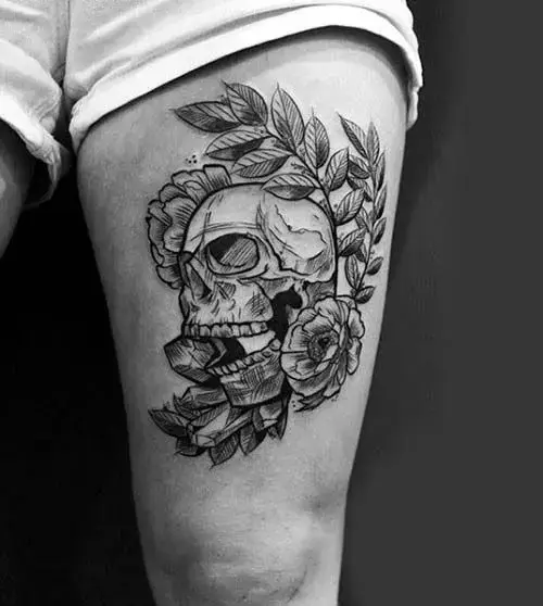 Skull tattoo on the hip