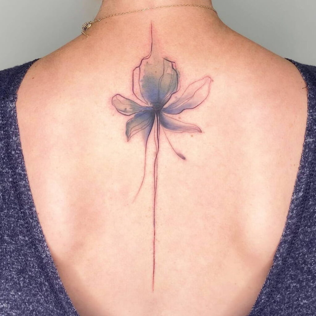 Flower tattoo on the back for women