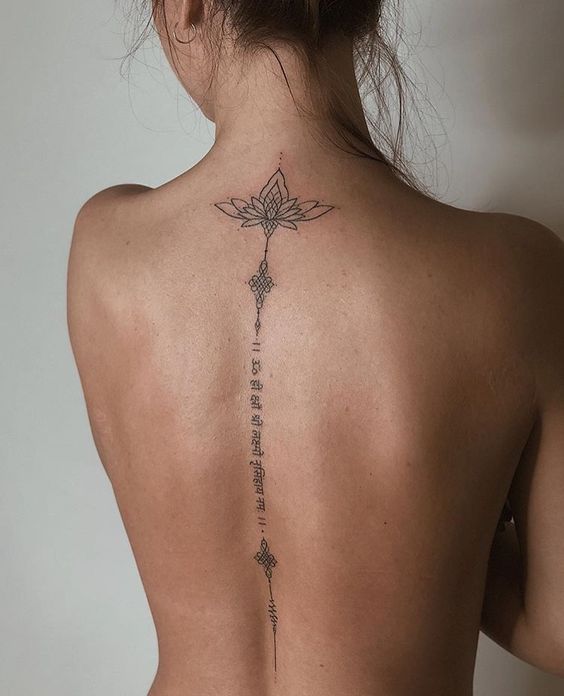 A beautiful tattoo on the back of a woman