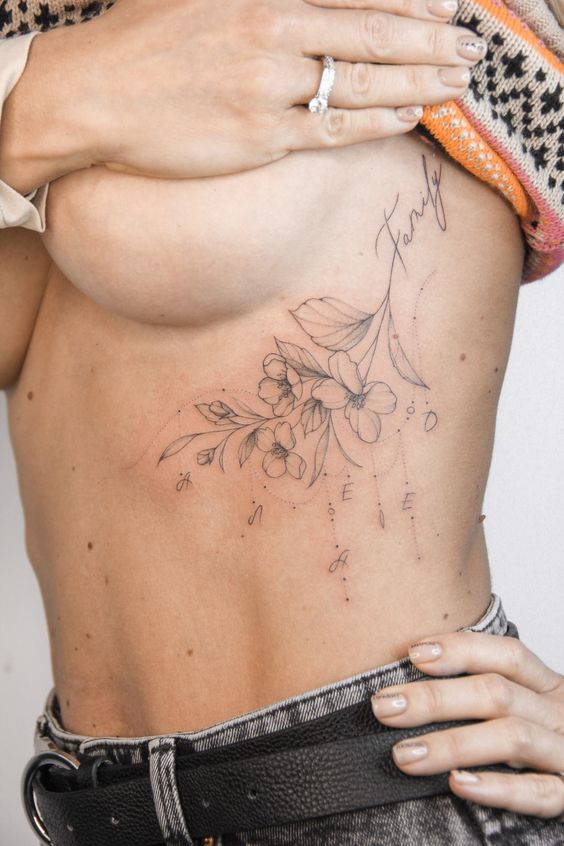 Tattoo flowers under the breast