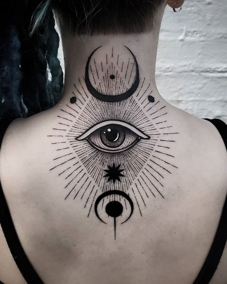 Black and gray eye tattoo on the back