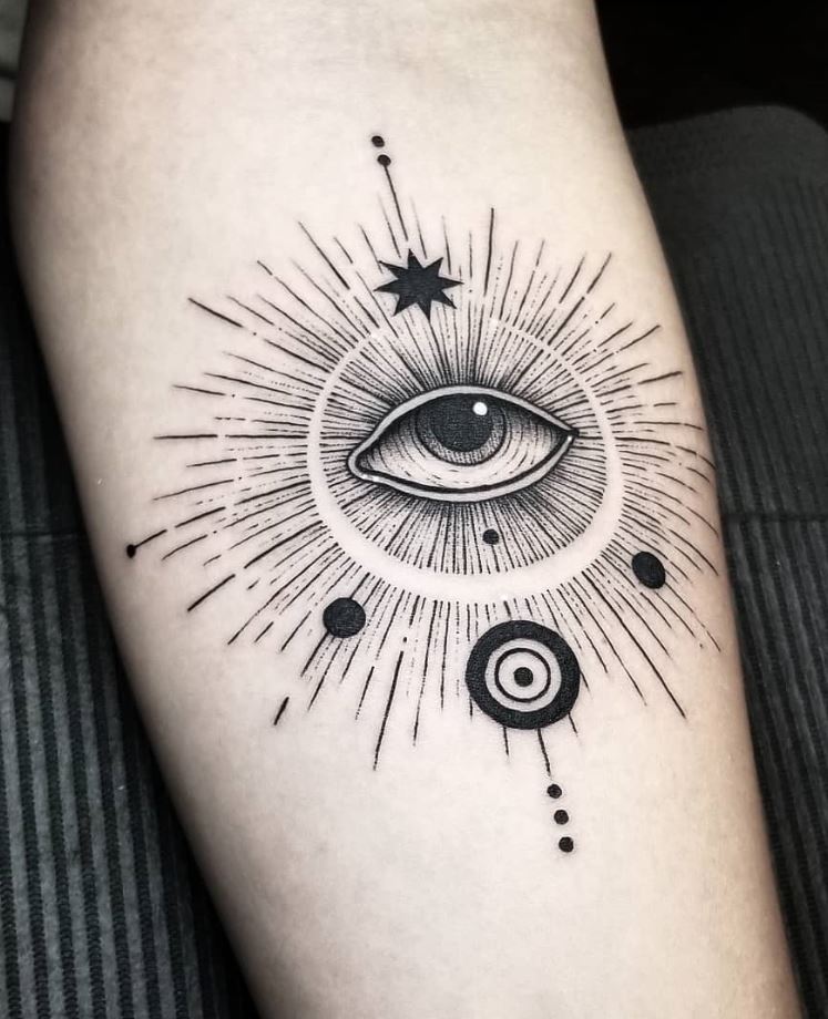 Black and gray eye tattoo on the arm