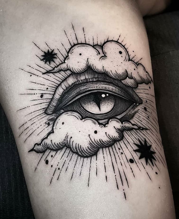 Black and gray eye tattoo on the arm