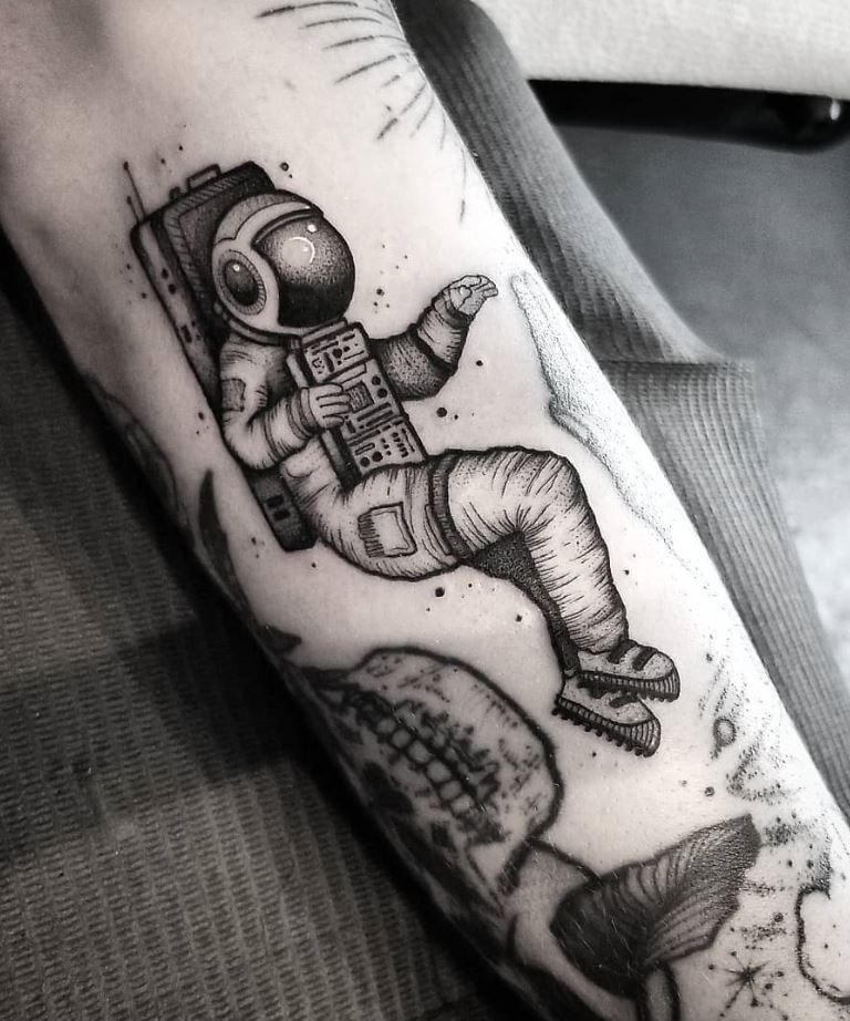 Astronaut tattoo in black and gray style