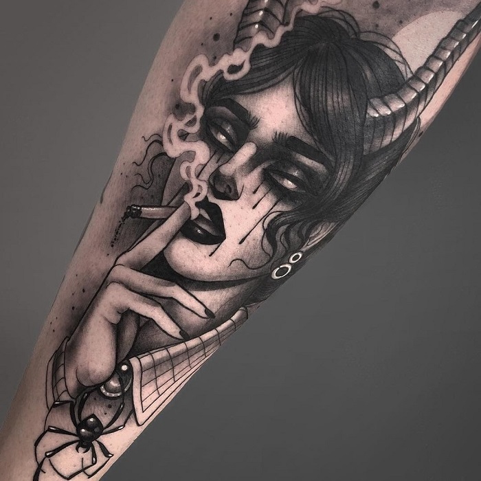 Tattoo of a girl on her shin