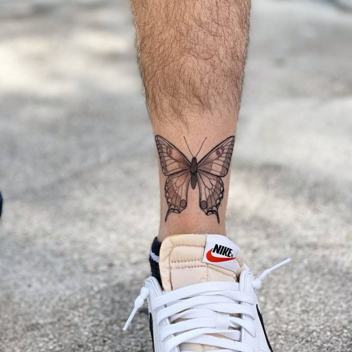 Butterfly tattoo on the shin