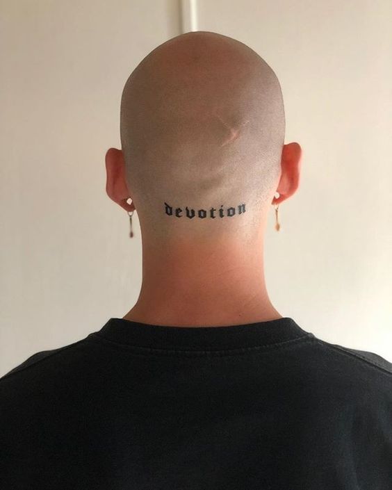 Tattoo with an inscription on the back of the head