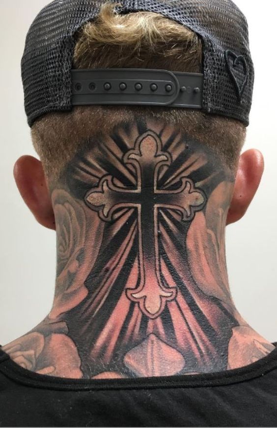 Cross tattoo on the back of the head