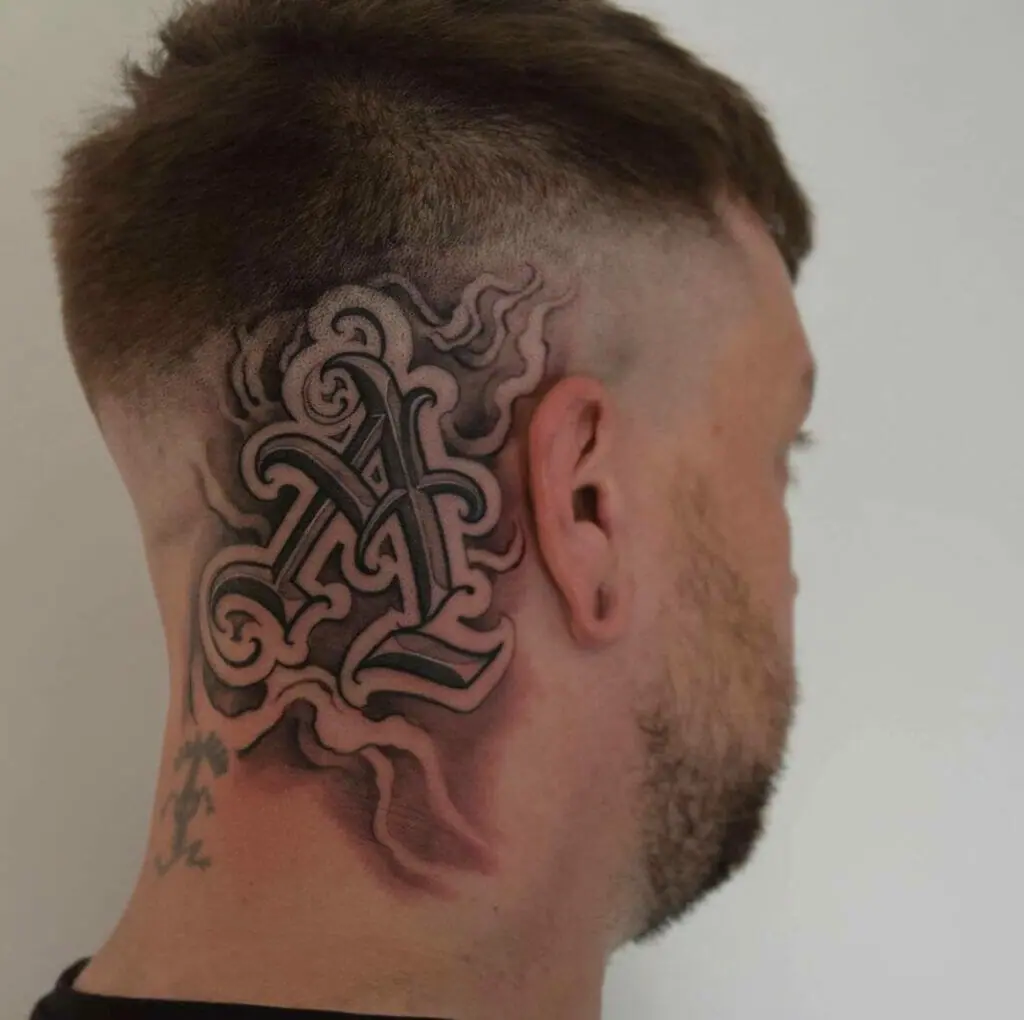 Tattoo on the back of his head with a letter