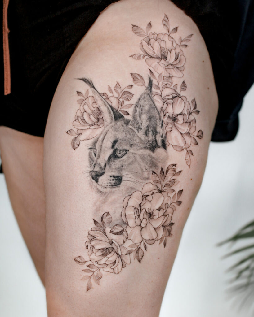 Cheetah tattoo on the thigh